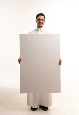 Saudi Man in Thobe Holding Blank Board Mockup