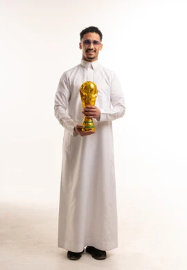 Saudi Man Holding Gold World Cup Trophy