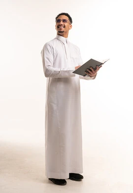 Saudi Man in White Thobe Holding Book in Studio