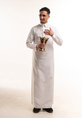 Saudi Man in White Thobe Holding Traditional Incense Burner