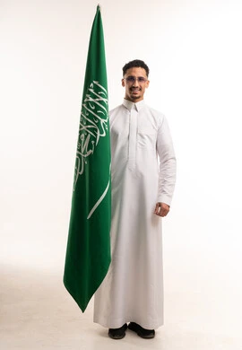 Saudi Man in White Thobe with National Flag