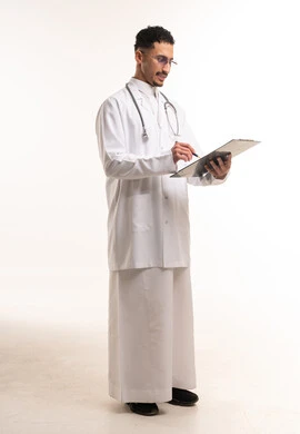 Saudi Male Doctor Writing on Clipboard