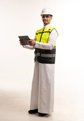 Saudi Engineer in Thobe and Safety Vest with Tablet