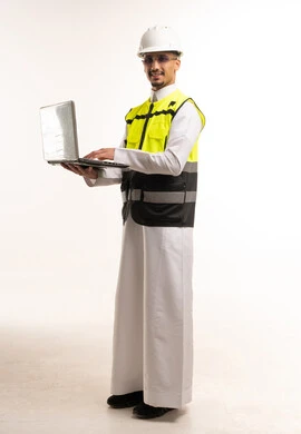 Saudi Engineer with Laptop and Safety Gear in Studio