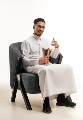 Saudi Man in Traditional Thobe with Incense Burner