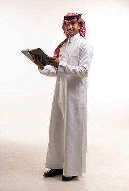 Saudi Man in Traditional Dress Holding a Book in Studio