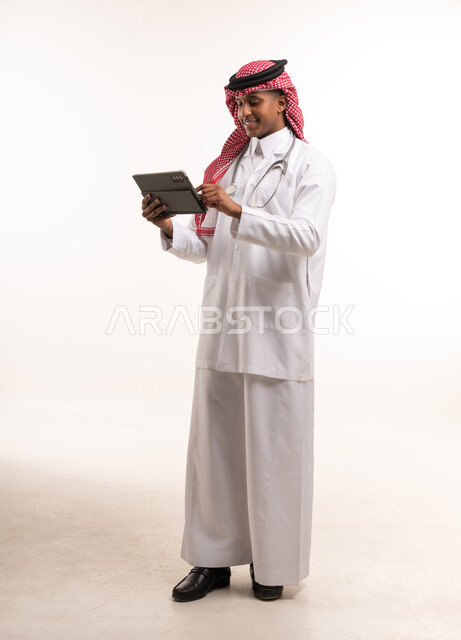 Saudi Male Doctor with Tablet in Studio