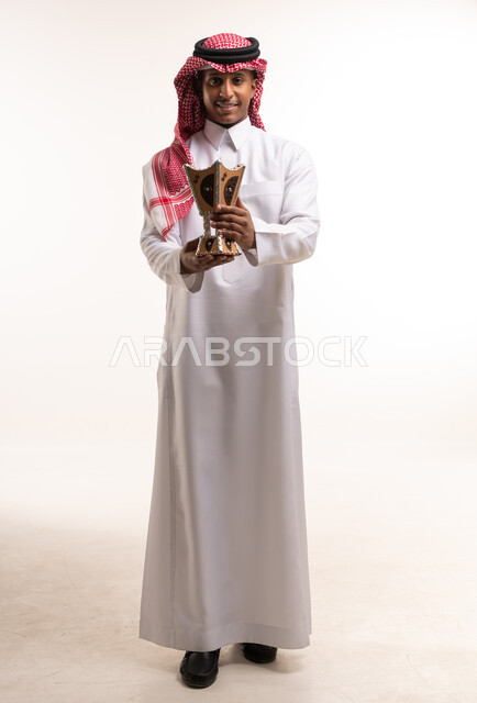 Saudi Man in Traditional Thobe Holding Incense Burner