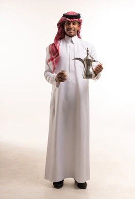 Saudi Man in Traditional Thobe Holding Arabic Coffee Pot