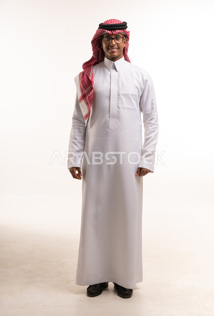 Saudi Man in Traditional White Thobe and Shemagh