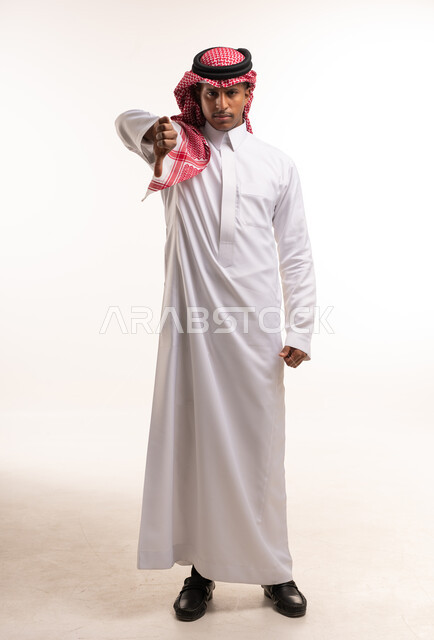 Saudi Man in Traditional Thobe Giving Thumbs Down