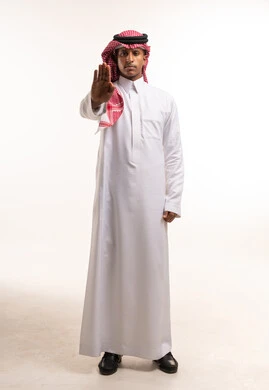 Saudi Man Making Stop Gesture in Traditional Clothing