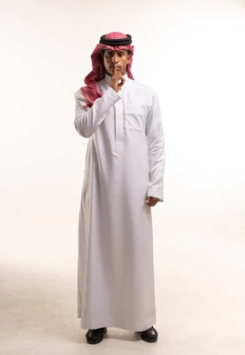 Saudi Man in Thobe Making Silence Gesture in Studio