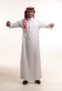 Saudi Man in Traditional Dress Pointing Downwards