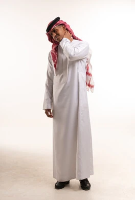 Saudi Man in Traditional Thobe Experiencing Neck Pain