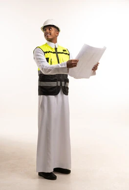 Saudi Male Engineer Holding Architectural Blueprints
