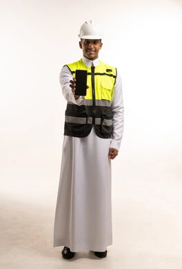 Saudi Site Engineer Holding Smartphone in Studio