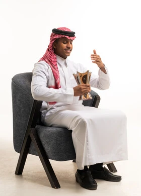 Saudi Man in Traditional Thobe Holding Incense Burner
