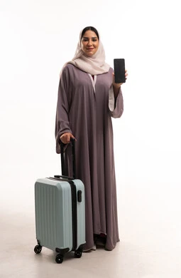 Arab Woman with Suitcase and Smartphone on White Background