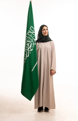 Saudi Woman with National Flag in Studio Setting