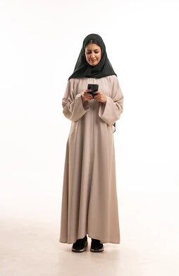 Emirati Woman in Abaya Using Smartphone Studio Shot