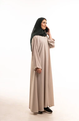 Arab Woman in Abaya Using Smartphone on White Background
