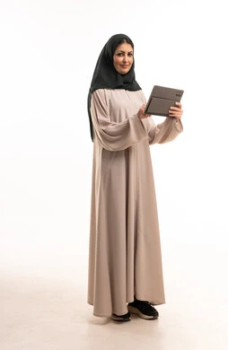 Arab Woman in Abaya Using Tablet on White Background