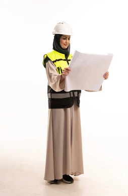Saudi Female Engineer Reviewing Architectural Blueprint