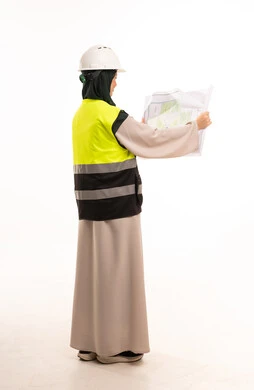 Saudi Female Engineer Reviewing Blueprints in Studio
