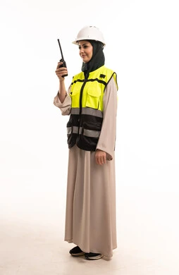 Saudi Female Engineer with Safety Vest and Walkie-Talkie