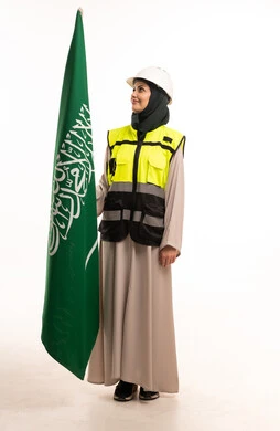 Saudi Woman Engineer Holding Flag in Safety Gear