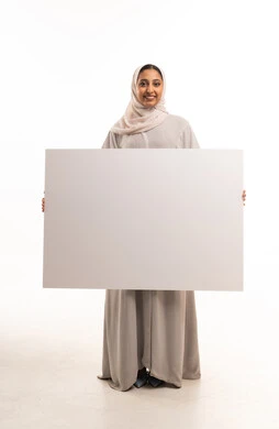Emirati Woman Holding Blank White Sign in Studio