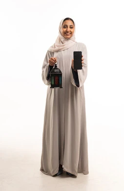 Emirati Woman Holding Ramadan Lantern and Smartphone