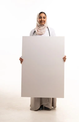 Arab Female Doctor Holding Blank Sign Board Studio Shot