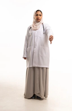 Arab Female Doctor Thumbs Down Studio Portrait