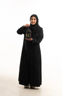 Saudi Woman in Black Abaya Holding Ramadan Lantern