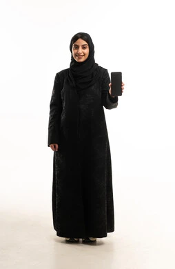 Saudi Woman in Traditional Abaya Showing Smartphone Screen