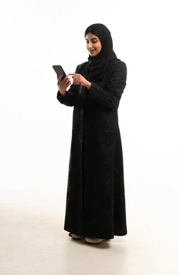 Saudi Woman in Black Abaya Using Smartphone