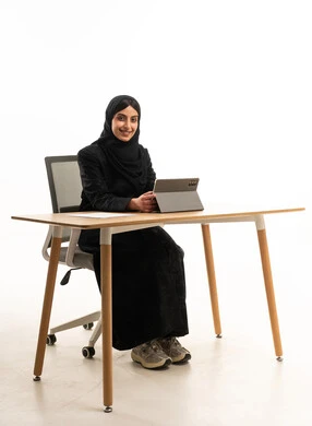 Saudi Businesswoman with Tablet at Office Desk