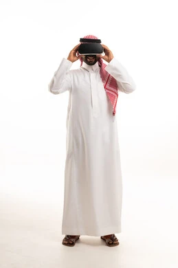 Saudi Man in Thobe Using VR Headset on White Background