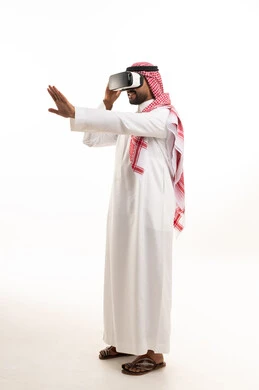 Saudi Man in Thobe Using VR Headset on White Background