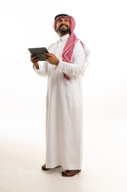 Saudi Man in Traditional Thobe Holding Digital Tablet