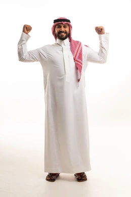 Saudi Man in Traditional Dress Flexing Strength