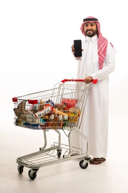 Saudi Man with Shopping Cart and Smartphone