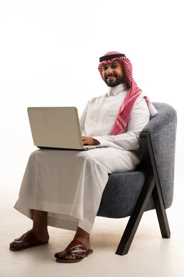 Saudi Man with Laptop in Traditional Thobe
