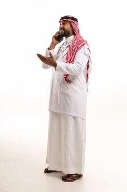 Saudi Male Doctor Talking on Smartphone in Studio