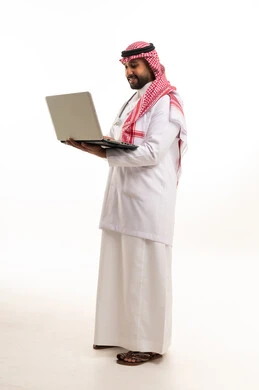 Saudi Male Doctor with Laptop in Traditional Dress