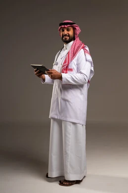 Saudi Male Doctor in Studio Holding Digital Tablet
