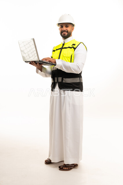 Saudi Engineer with Laptop and Safety Gear