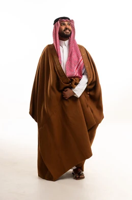 Saudi Man in Traditional Brown Farwa Studio Portrait